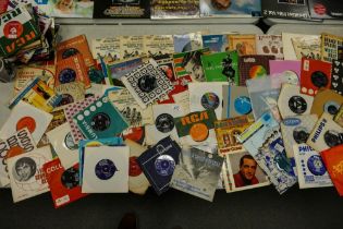 A large collection of 7" Single Records including Bowie, The Smurfs, Elvis, Tight Fit, Mary Martin