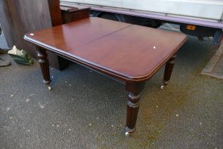 Early Victorian Extending Dining Table on turned legs with brass and ceramic castors. Height: 72.5cm