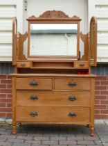 A Pine Dresser with art nouveau escutheons and fitted drawers and mirror. dowels between base and