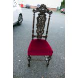 A Heavily Carved Victorian Hallchair with Velvet Upholstered Seat. Height: 122cm