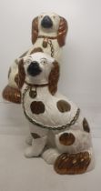 A Pair of Mid-Victorian Staffordshire Spaniels in Gold Lustre Patterning.