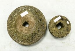 Two Weathered Grindstones. Diameter of largest: 37cm