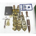 Victorian horse brasses on leather straps , cased knife and spoon set and an Indian knife