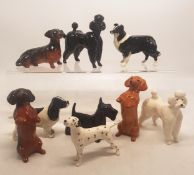 A collection of 9 small Beswick dogs to include Dalmation, begging Dachshunds, Scottie dog etc (9)