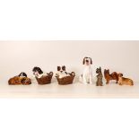 Royal Doulton dogs to include Puppy in basket x 2 , puppy yawning, small Dachshund etc (7)