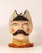 A Victorian Boer War Character Jug depicting Lord Kitchener. Chip to rim with restored section