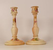 A Pair of Royal Worcester Blush Candlesticks, one reglued to base