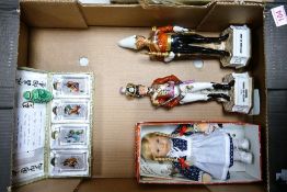 A mixed collection of items to include boxed Chinese glass bottles, two ceramic officer figures,
