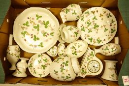 A collection of Wedgwood Wild strawberry to include side plates, vases, ginger jars, mantle clock