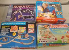 Four Boxed Playsets to icnlude Robotix, Fisher Price, Touchdown Pinball and an Bluebox M1 Motorway