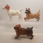 A collection of Beswick dogs to include Jack Russell Terrier together with a Cairn Terrier Playing