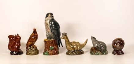 Beswick decanters to include Peregrine Falcon (1/4 full), loch ness ( empty), haggis (empty) ,