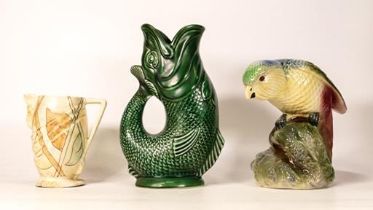 Dartmouth guggle jug together with Kensington jug and a model of a parrot (3)