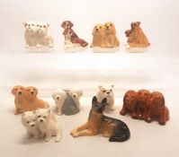 A collection of 10 small seated Beswick dogs to include Bulldogs, Alsation, Old English Sheepdog,