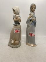 Lladro figure of girl holding flowers together with a NAO figure of girl holding puppy (2)