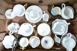 A collection of Shelley milk jus and sugar bowls together with Wileman & Co milk jug and sugar