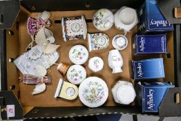 A mixed collection of items to include Wedgwood mantle clocks, Aynsley lidded pots, vases, Angel