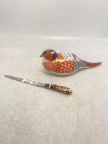 A Royal Crown Derby Pheasant Paperweight together with a Royal Crown Derby Envelope Knife