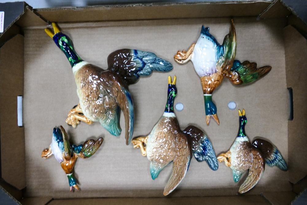 A set of three Falcon ware flying mallard duck wall plaques together with two Beswick flying