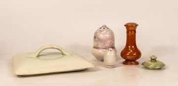Three William Moorcroft lustre pepper pots together with two Moorcroft lids