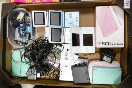 A collection of vintage Game systems including Gameboys, Nintendo DS Lite, Game Boy Advance with