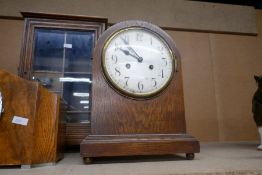 Two 1930s Oak cased mantle clocks and a smoker's cabinet