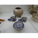 An oriental style cream crackle glaze bowl on three feet, and a pair of oriental blue and white smal