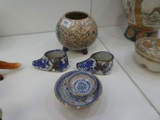 An oriental style cream crackle glaze bowl on three feet, and a pair of oriental blue and white smal