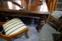A Victorian mahogany dining table on octagonal shaped legs