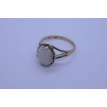 9ct yellow gold dress ring with white opal in 8 claw mount on split shoulder supports, size M/N, app