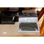Olivetti 82 typewriter, the other by Royal and a Gloria Sewing machine