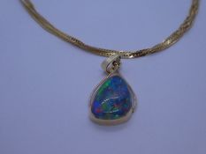 14K gold opal triplet pendant marked 585, hung on a 9ct Singapore neckchain, 41cm, marked 375, chain