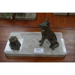 A French Art Deco inkstand having bronzed figure of seated dog, and a French Art Deco marble mantel