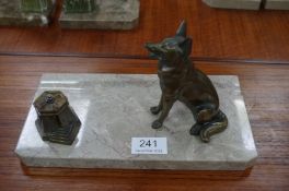 A French Art Deco inkstand having bronzed figure of seated dog, and a French Art Deco marble mantel
