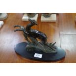 An Art Deco bronzed spelter figure of prancing deer and one other lamp with deer figure, on marble b