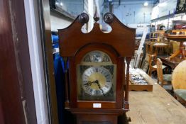A repro mahogany short cased clock