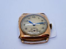 A 9ct gold watch head with numerical hour markers and a subsidiary seconds dial