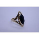 9ct yellow gold dress ring with oval black cabouchon panel, marked 375, size J, approx 2.5g