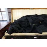 A quantity of Naval officer's uniform including Great Coat in metal trunk and other metal clothing
