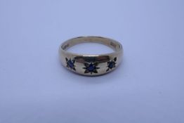 9ct yellow gold gypsy ring with 3 starburst set sapphires, size L, 2g approx, marked 375
