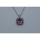 18ct white gold Art Deco style ruby and diamond encrusted pendant with diamond set loop hung on an 1