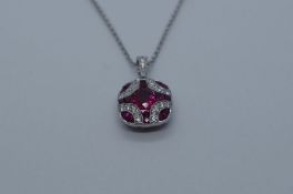 18ct white gold Art Deco style ruby and diamond encrusted pendant with diamond set loop hung on an 1