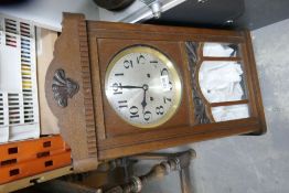 An oak wall clock, having silvered dial