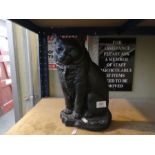 A cast metal doorstop in the form of a cat