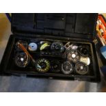 A tool box containing various fishing reels and other accessories and a vintage white painted First