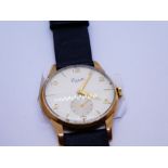 A 9ct gold Everite 15 jewels wristwatch with a genuine leather black strap