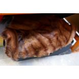 Case containing assorted fur coats