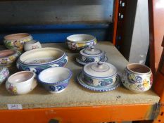 A quantity of Poole pottery bowls, butter dishes, sugar bowls, coffee cups, etc
