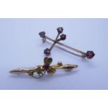 9ct yellow gold games set brooch marked 9ct and another 9ct floral design brooch set with red stone,