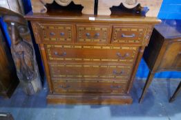 A pair of modern pine bedside cupboards and a chest of drawers of Victorian style